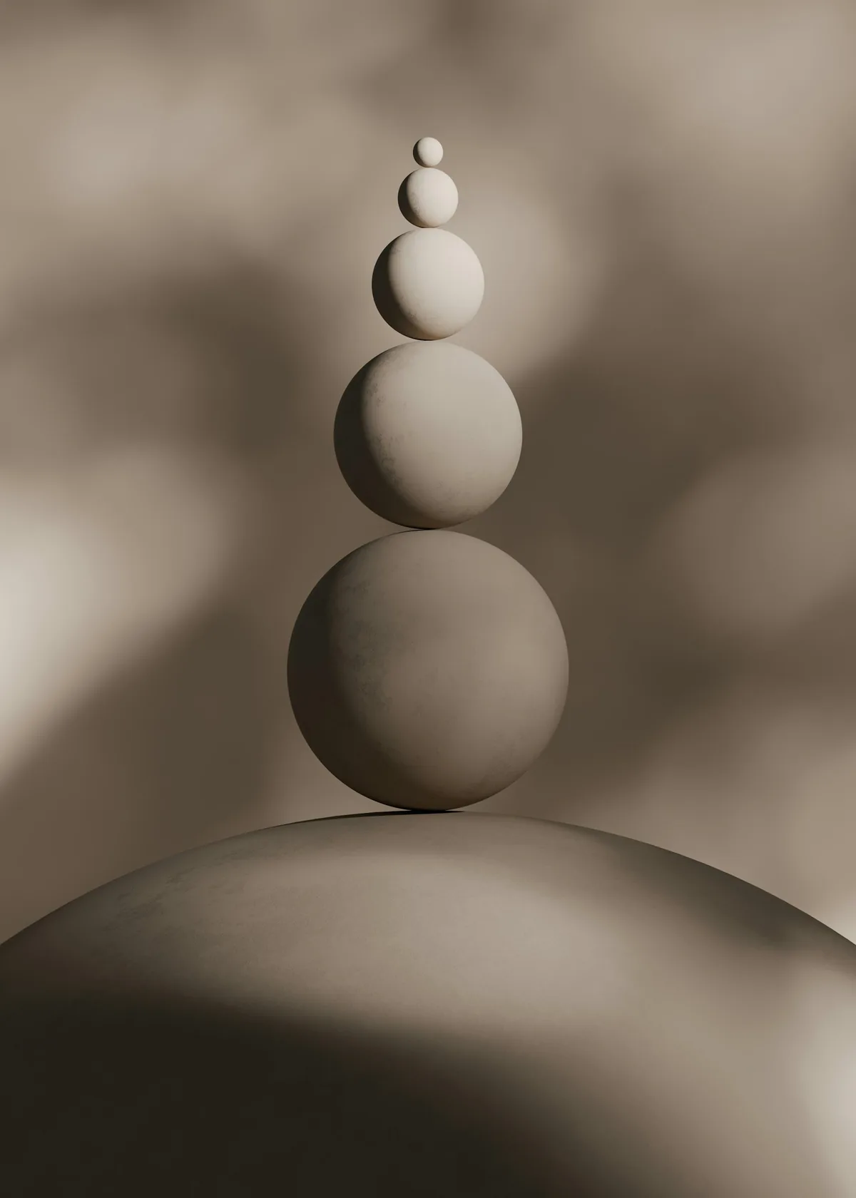 Balanced stacked stone spheres in warm light
